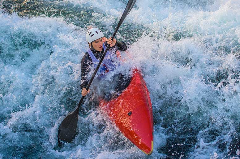 Woman white water rafting