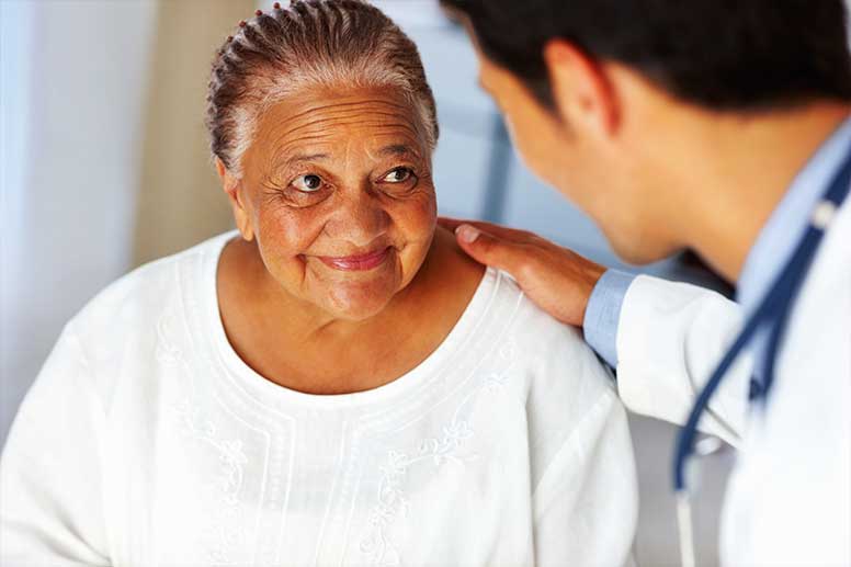 Urologist with senior patient