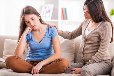 Mom consoling daughter