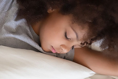 Young girl sleeping peacefully.