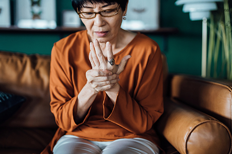 woman grasping her wrist