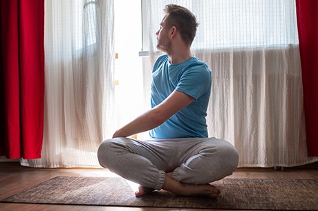 man stretching sciatica nerve