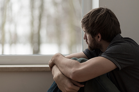 Man looking out of window