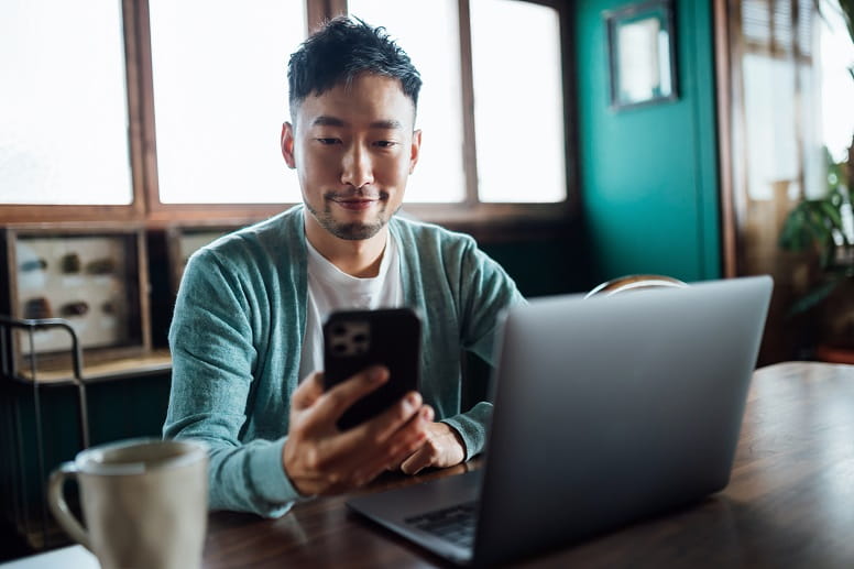 A man checking MyGeisinger on his mobile device
