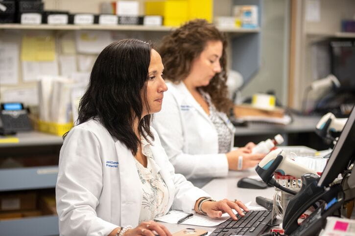 Two pharmacists working